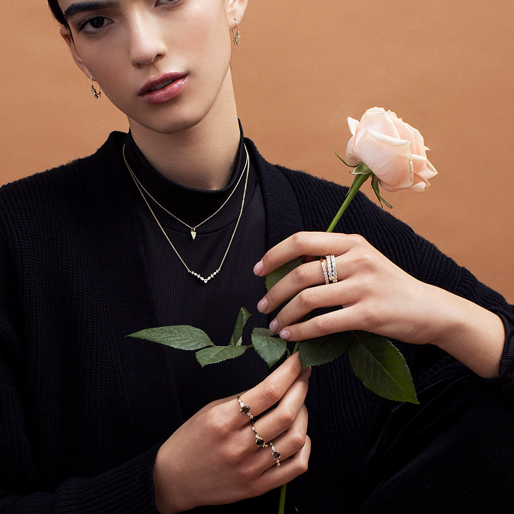 Fine gold chain with a triangle-shaped pendant studded with a 3-point diamond
