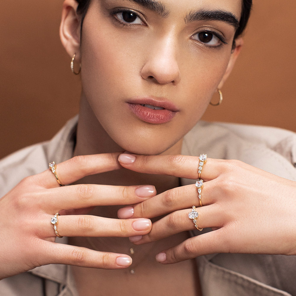 An impressive diamond ring set with a central round diamond combined with drop and marquise cut diamonds