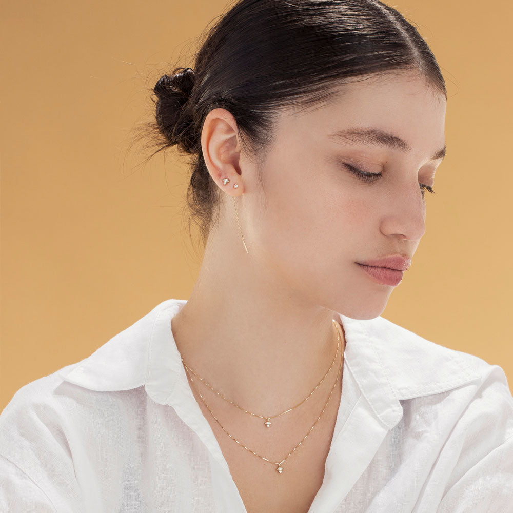 Fine gold chain with a diamond pendant combined with a marquise-cut diamond (7 points) and a round diamond