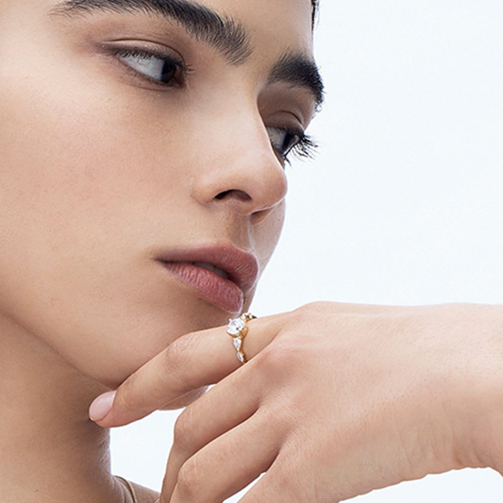 An impressive diamond ring set with a central round diamond combined with drop and marquise cut diamonds