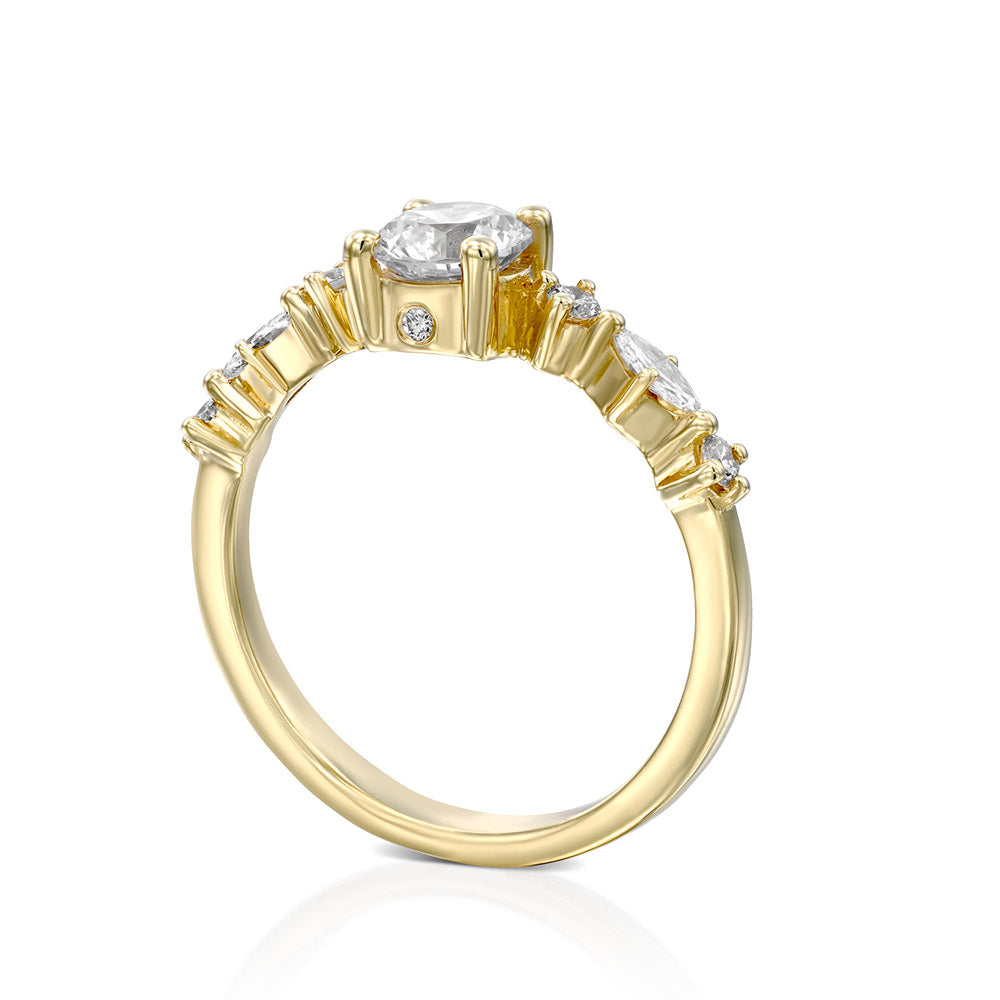 An impressive lab diamond ring set with a central round lab diamond combined with marquise-cut lab diamonds and round diamonds