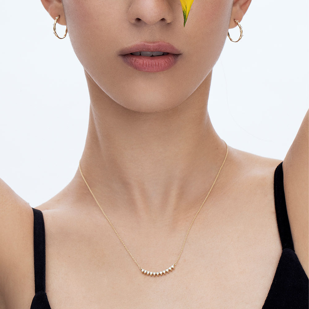 A particularly amazing horizontal white diamond necklace