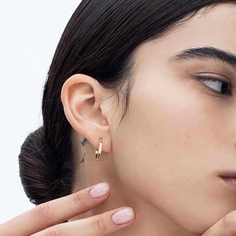 Hexagon geometric hoop earrings studded with diamonds