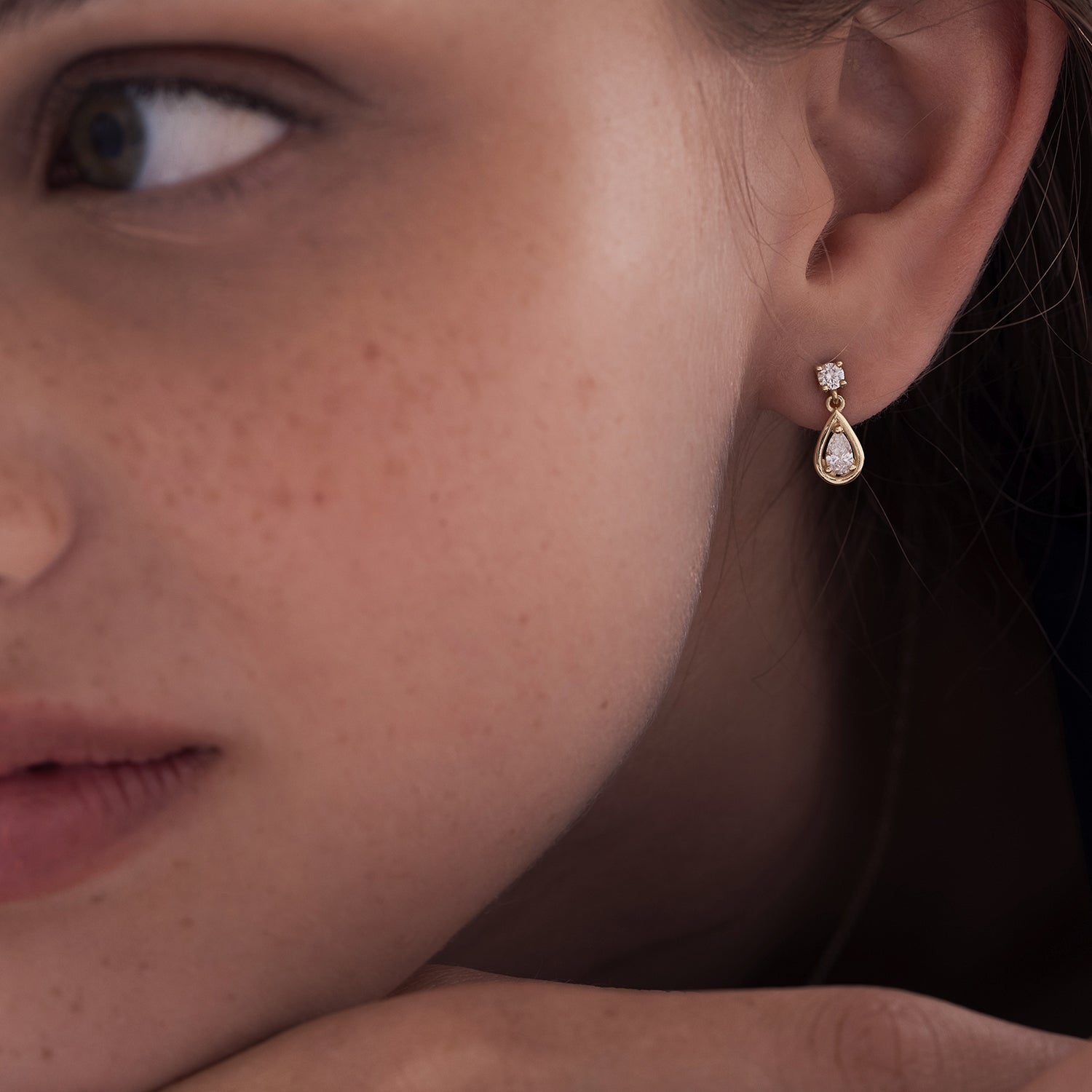 Dangling attached lab diamond earrings in a round cut and a drop