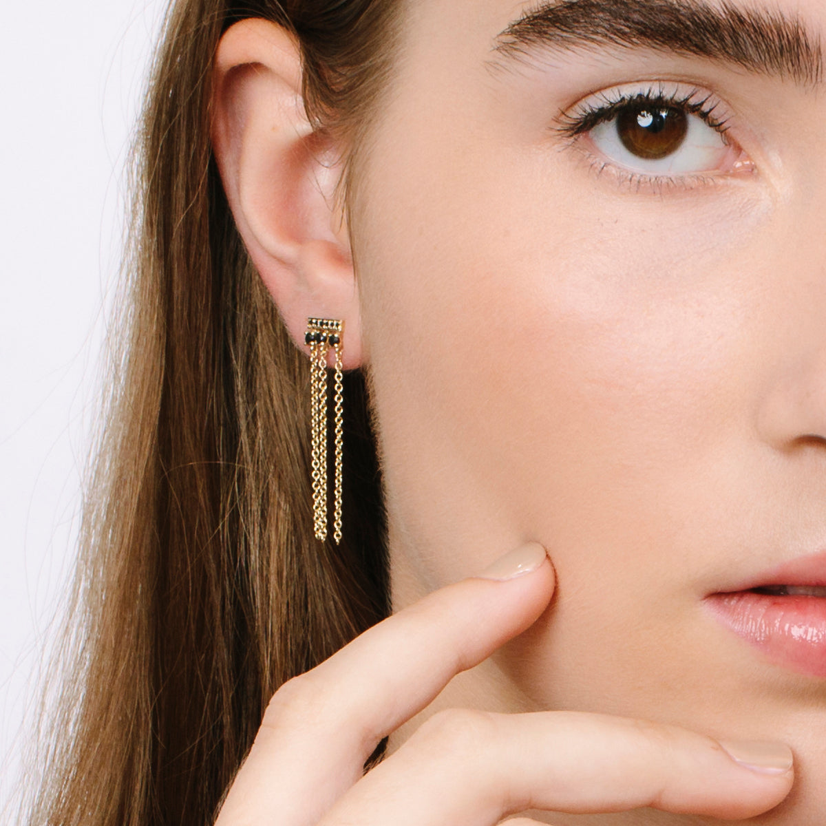 Special gold and black diamond earrings combined with swinging necklaces