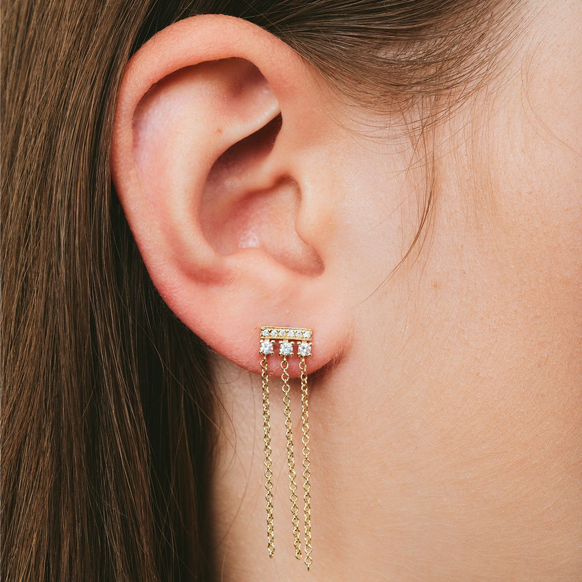 Special gold and diamond earrings combined with swinging necklaces