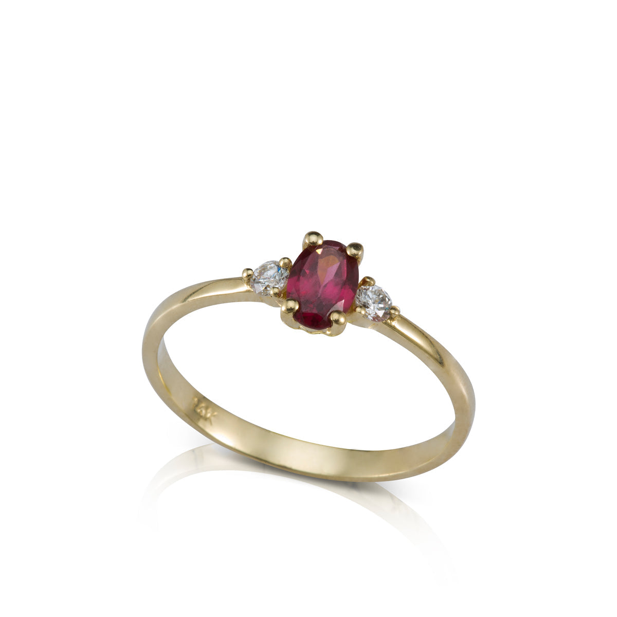 A gold ring set with an oval garnet and 2 side diamonds