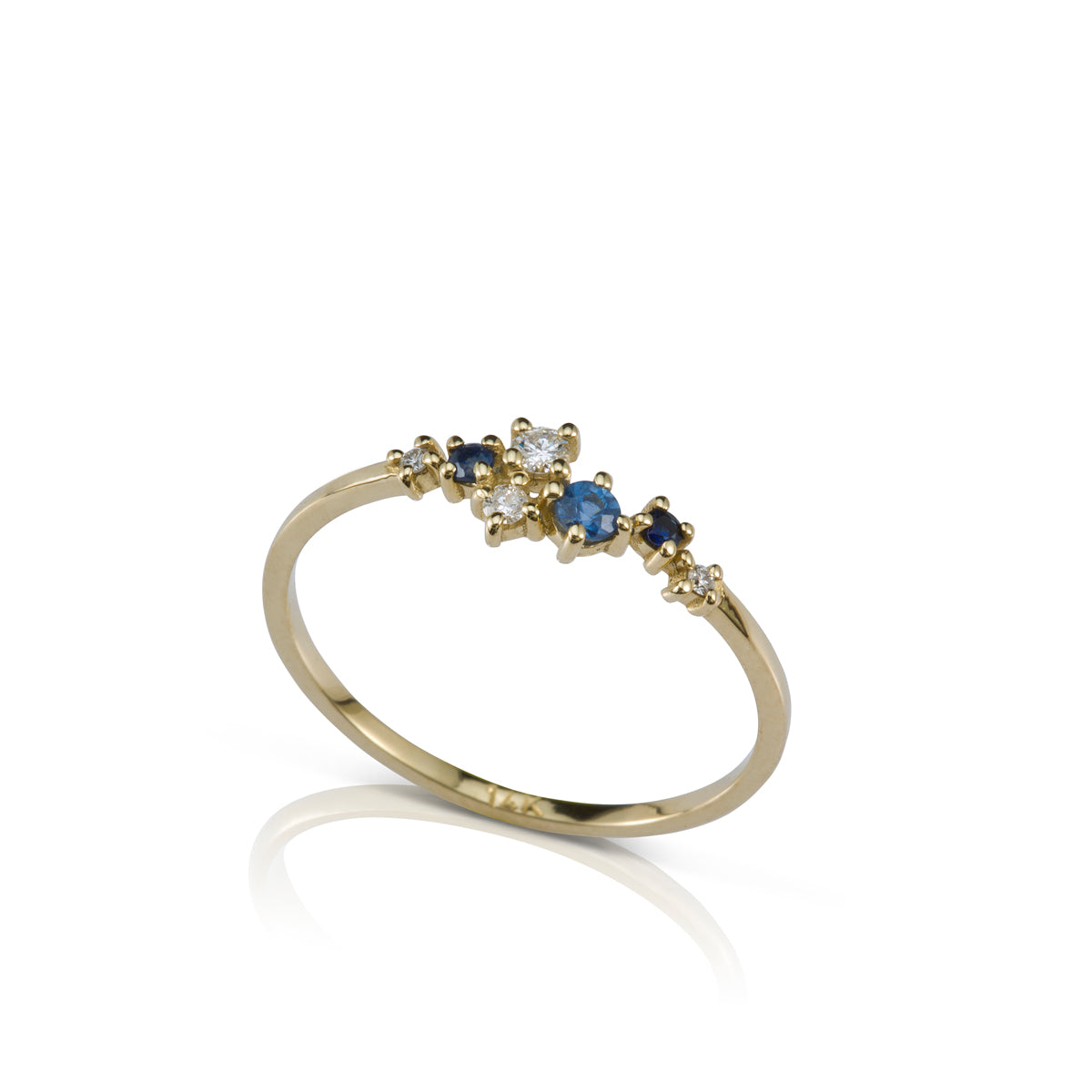 A delicate and special gold ring studded with diamonds and sapphires of varying sizes