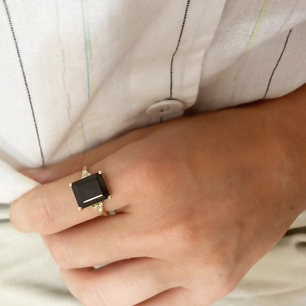 Engagement ring studded with rectangular black onyx and 6 sided diamonds