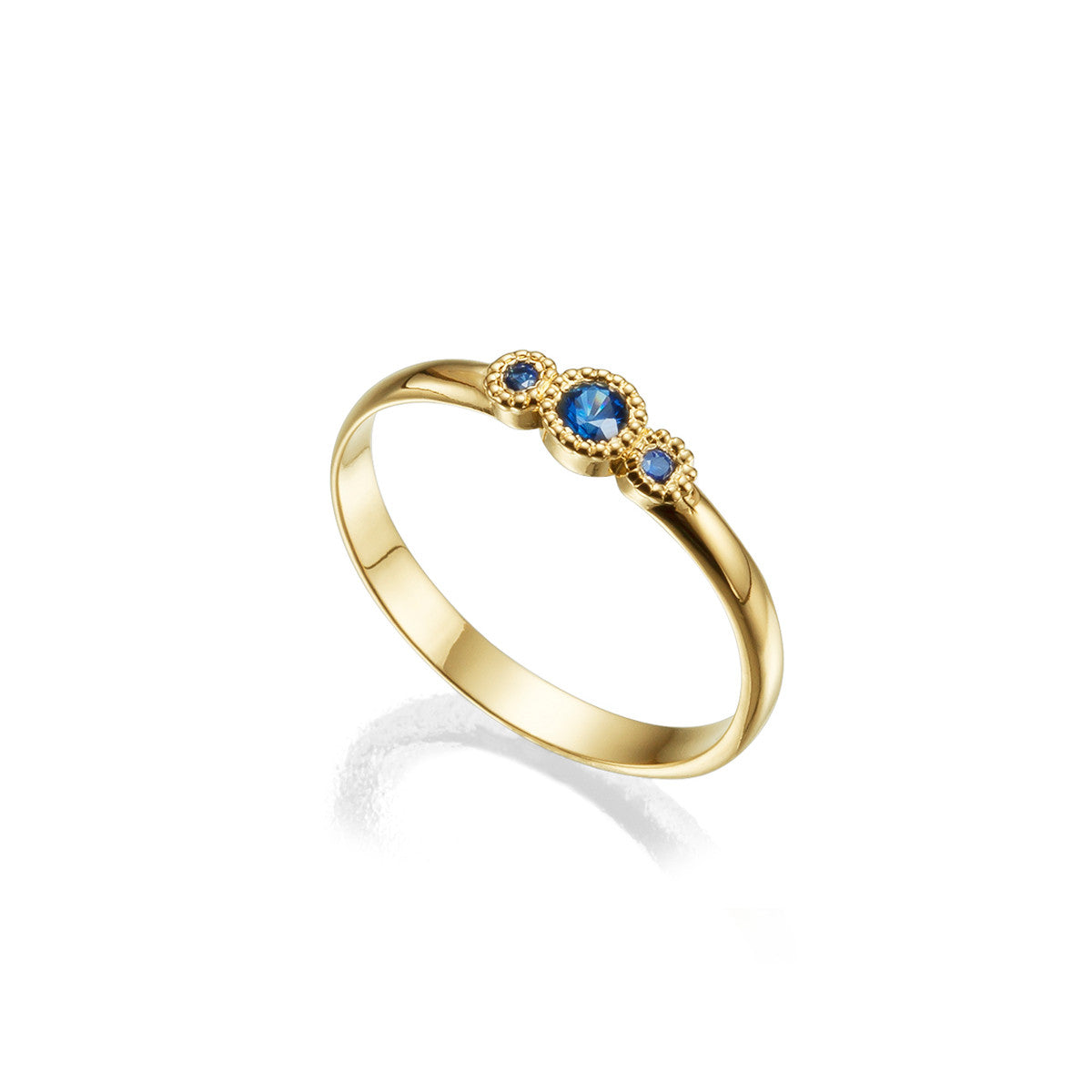 Fine gold ring studded with sapphires