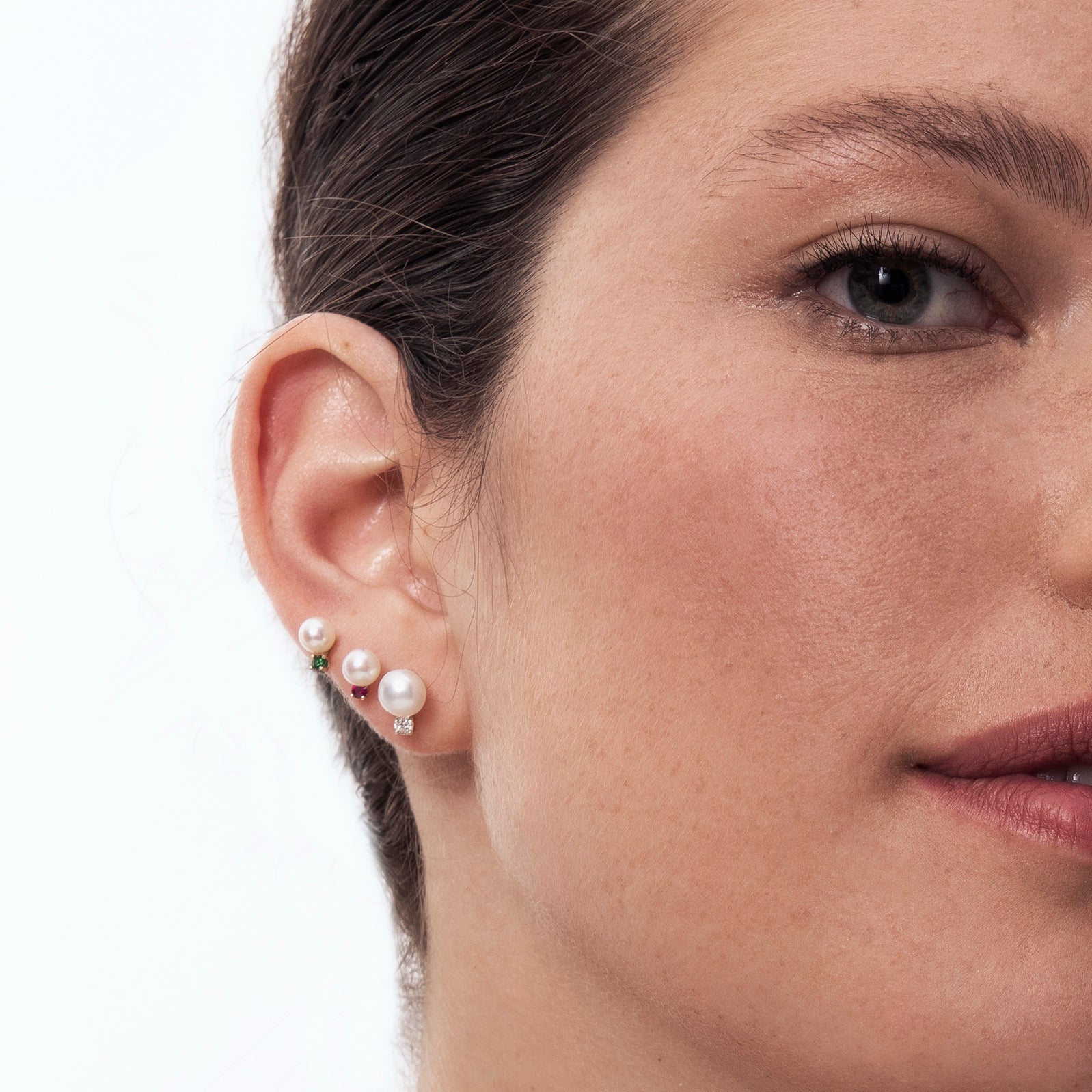 Studded pearl and emerald earrings