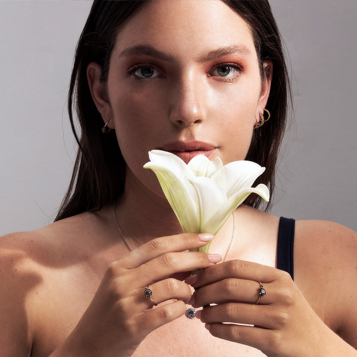 An engagement ring set with a trillion-cut black diamond and black diamonds all around