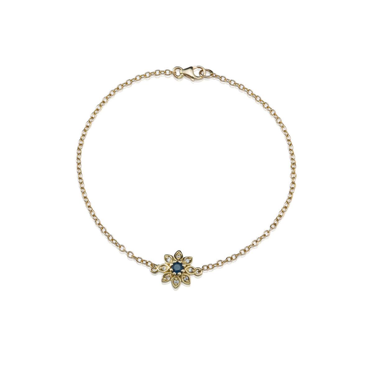 Gold bracelet with a flower studded with diamonds and sapphires