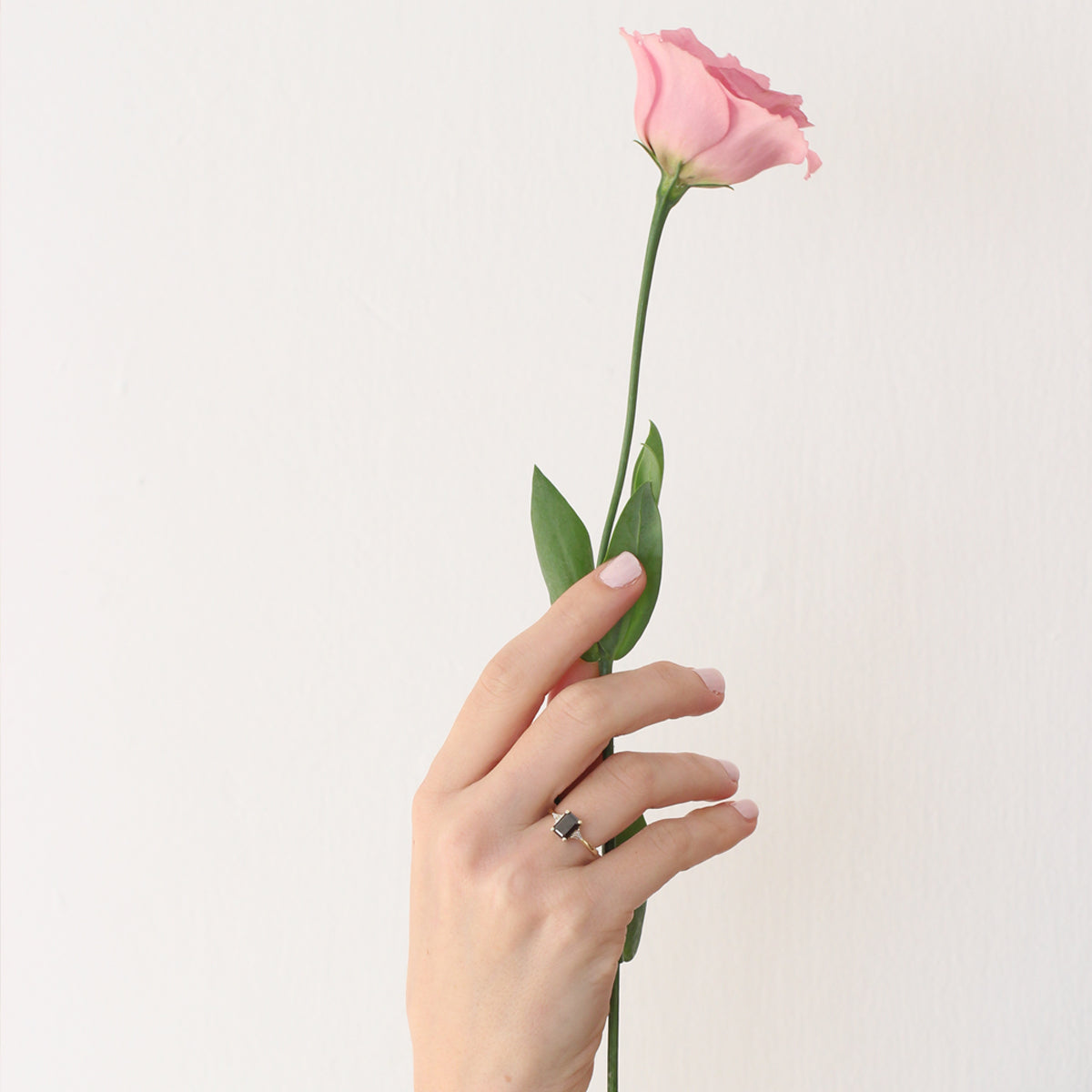 Rectangular black diamond ring and white triangular diamonds