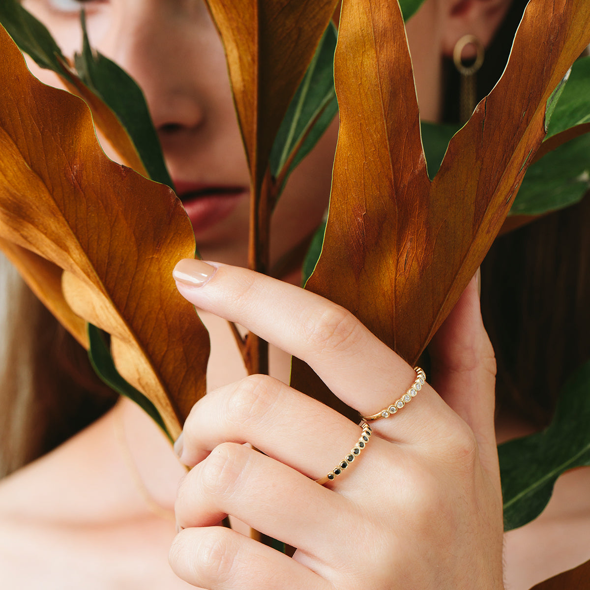 Gold ring with diamonds in cup setting