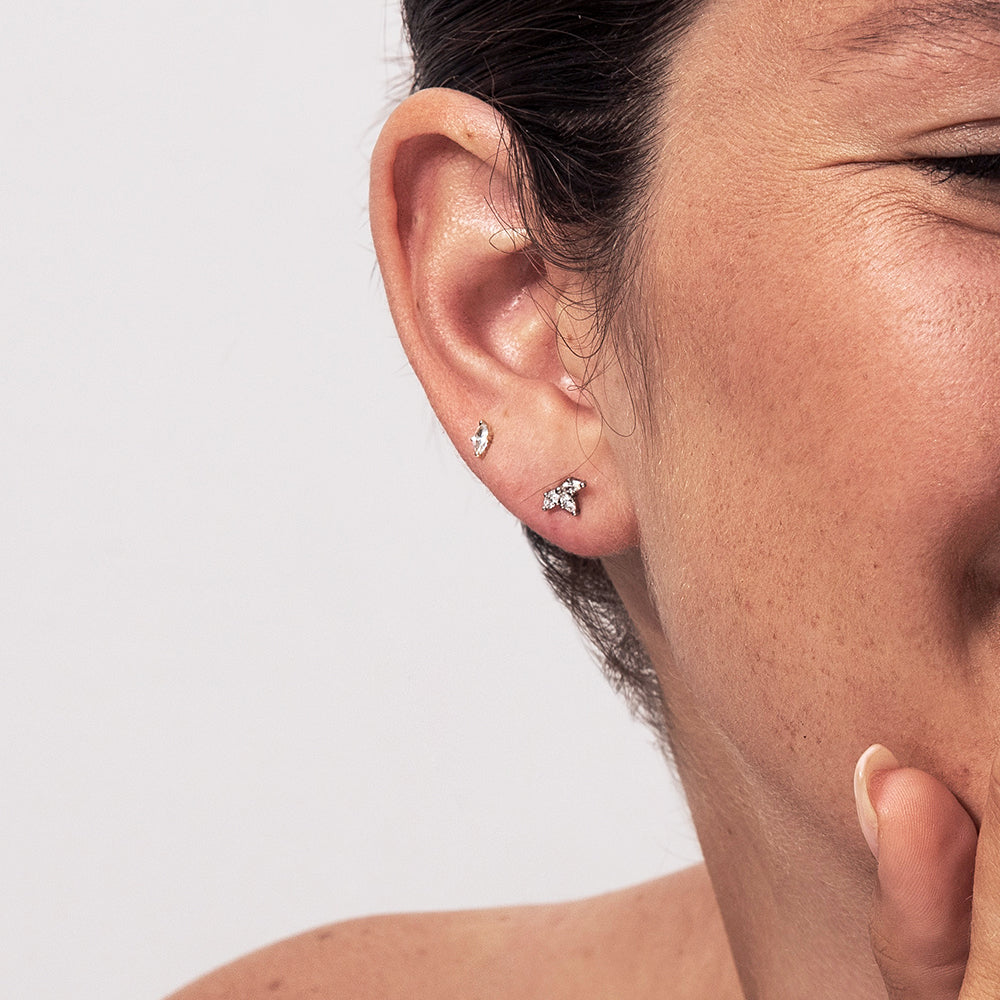 Gold solitaire earrings studded with marquise-cut diamonds