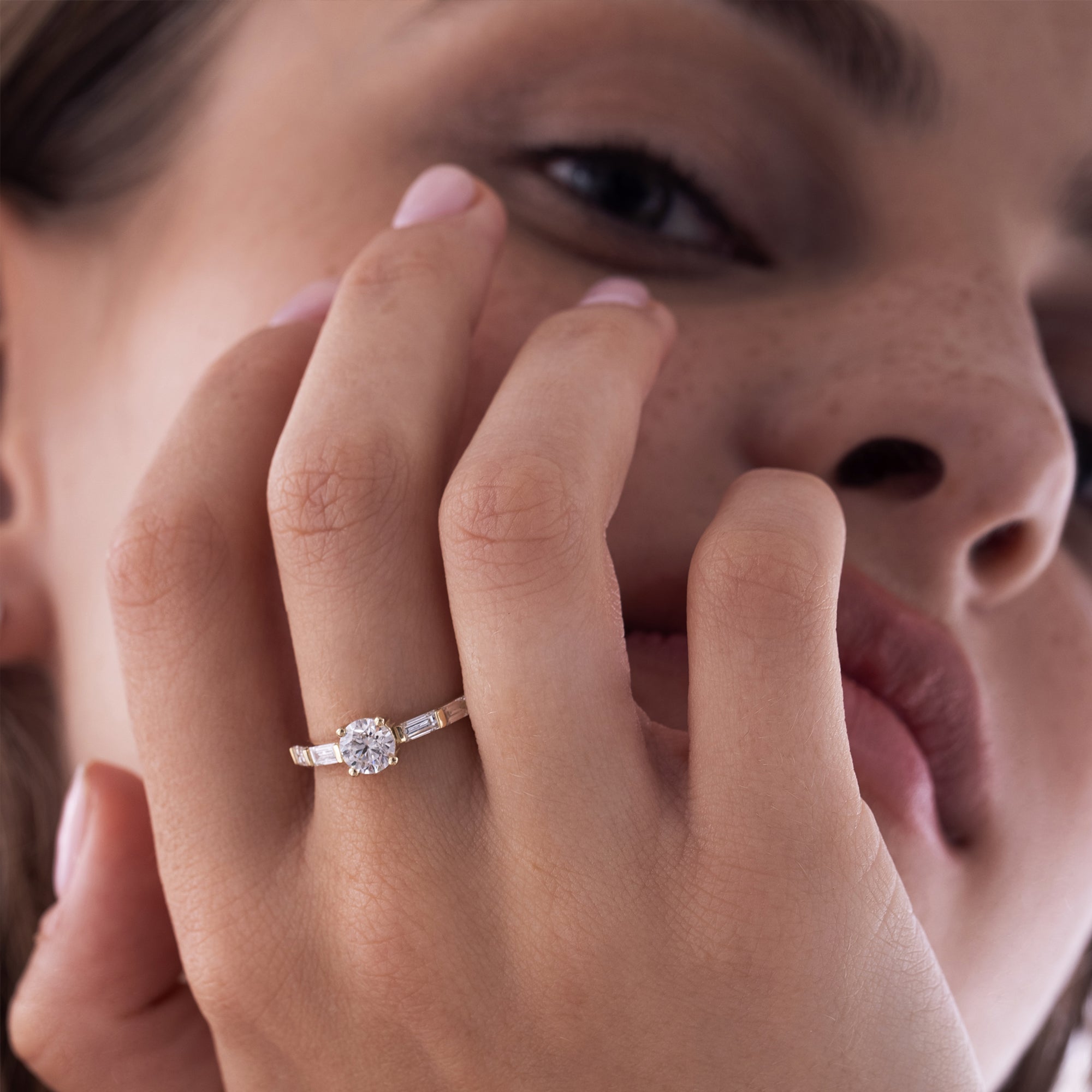 A beautiful engagement ring set with a 70-point lab diamond and baguette-cut diamonds