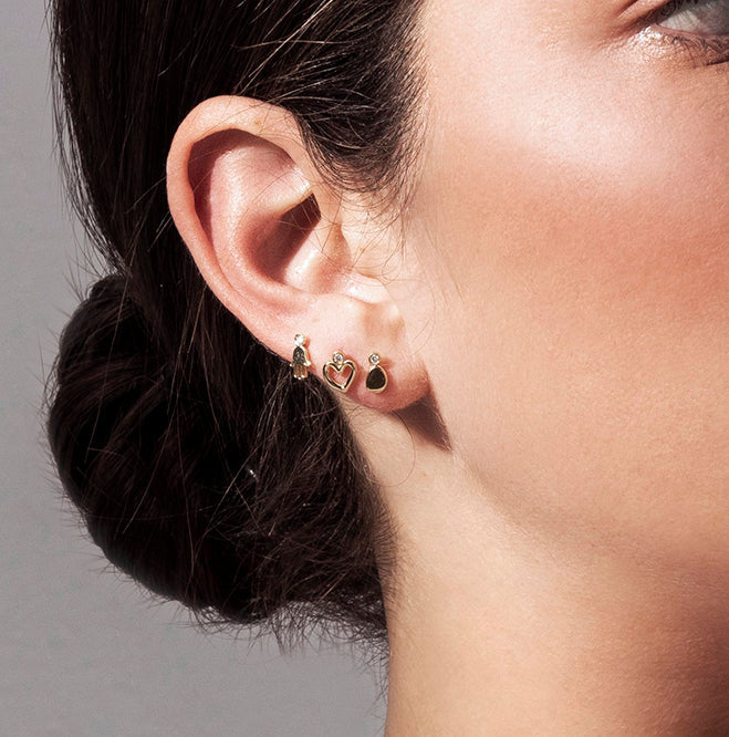 Gold attached earrings with diamonds in an amorphous point design