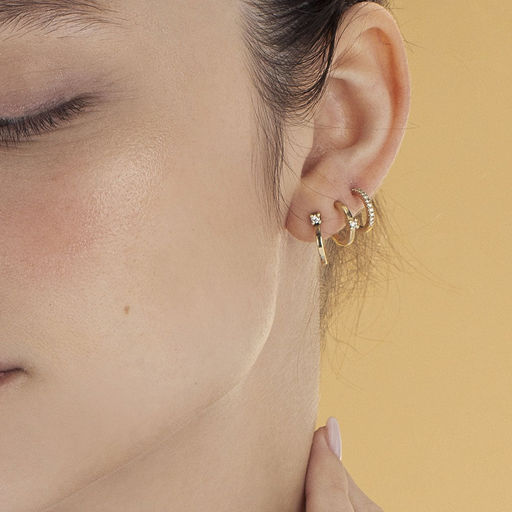Classic small hoop earrings studded with white diamonds