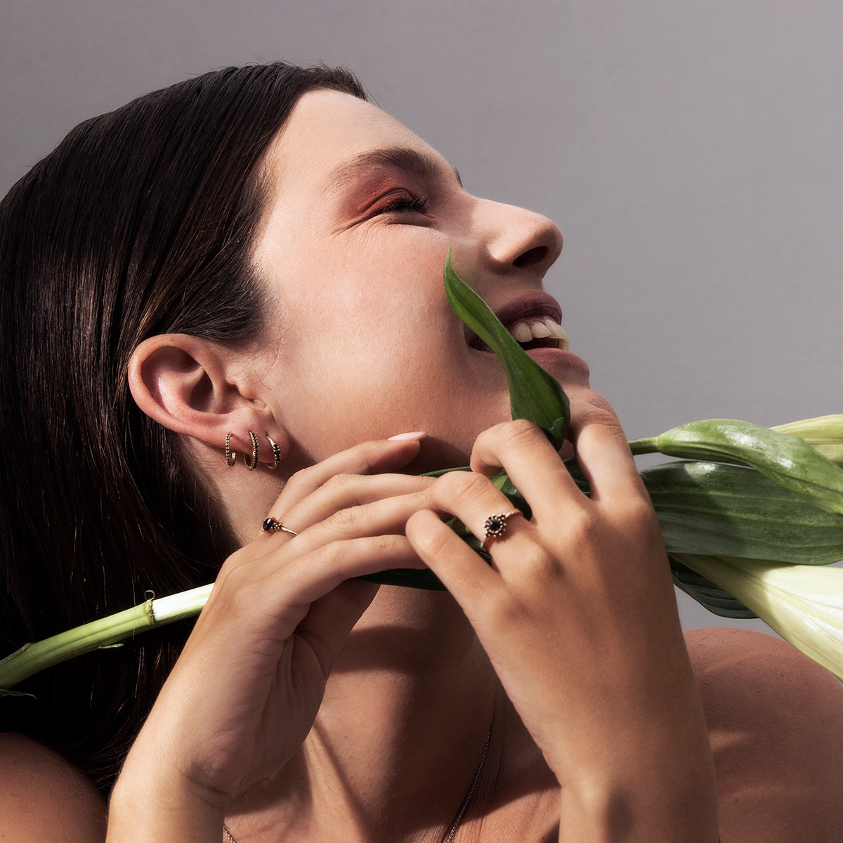 Small hoop earrings set with 3 black diamonds