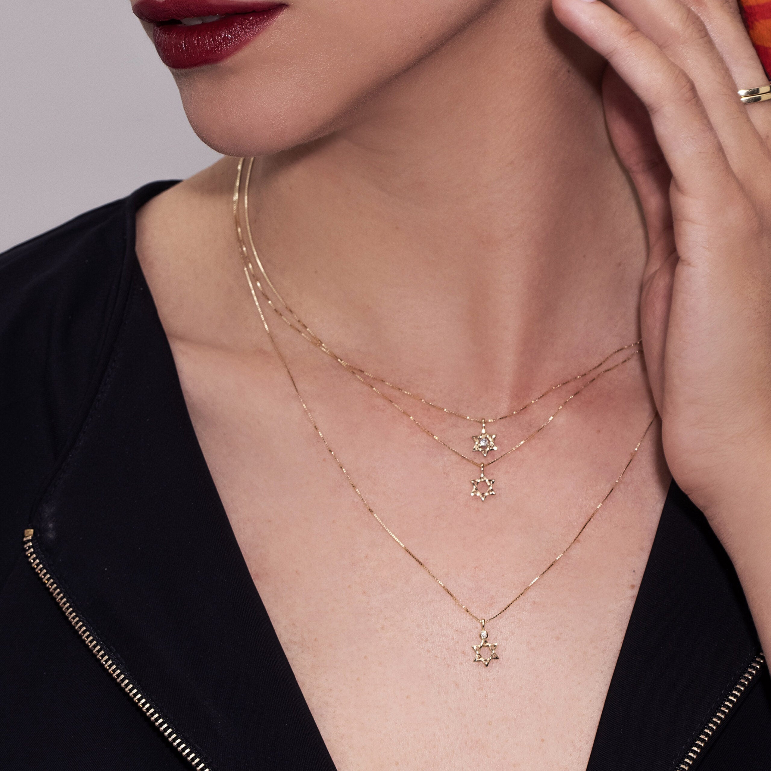 Gold necklace designed with a Star of David pendant set with a diamond, 1.5 points, 14 carat gold