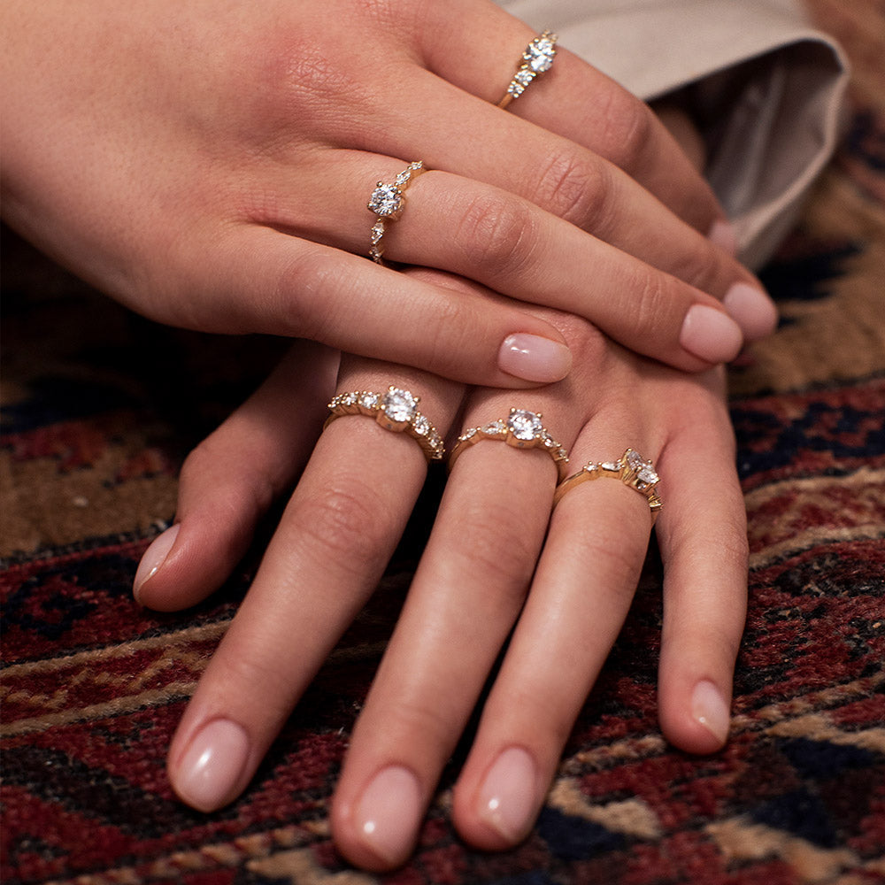 An impressive diamond ring set with a central round diamond combined with drop and marquise cut diamonds