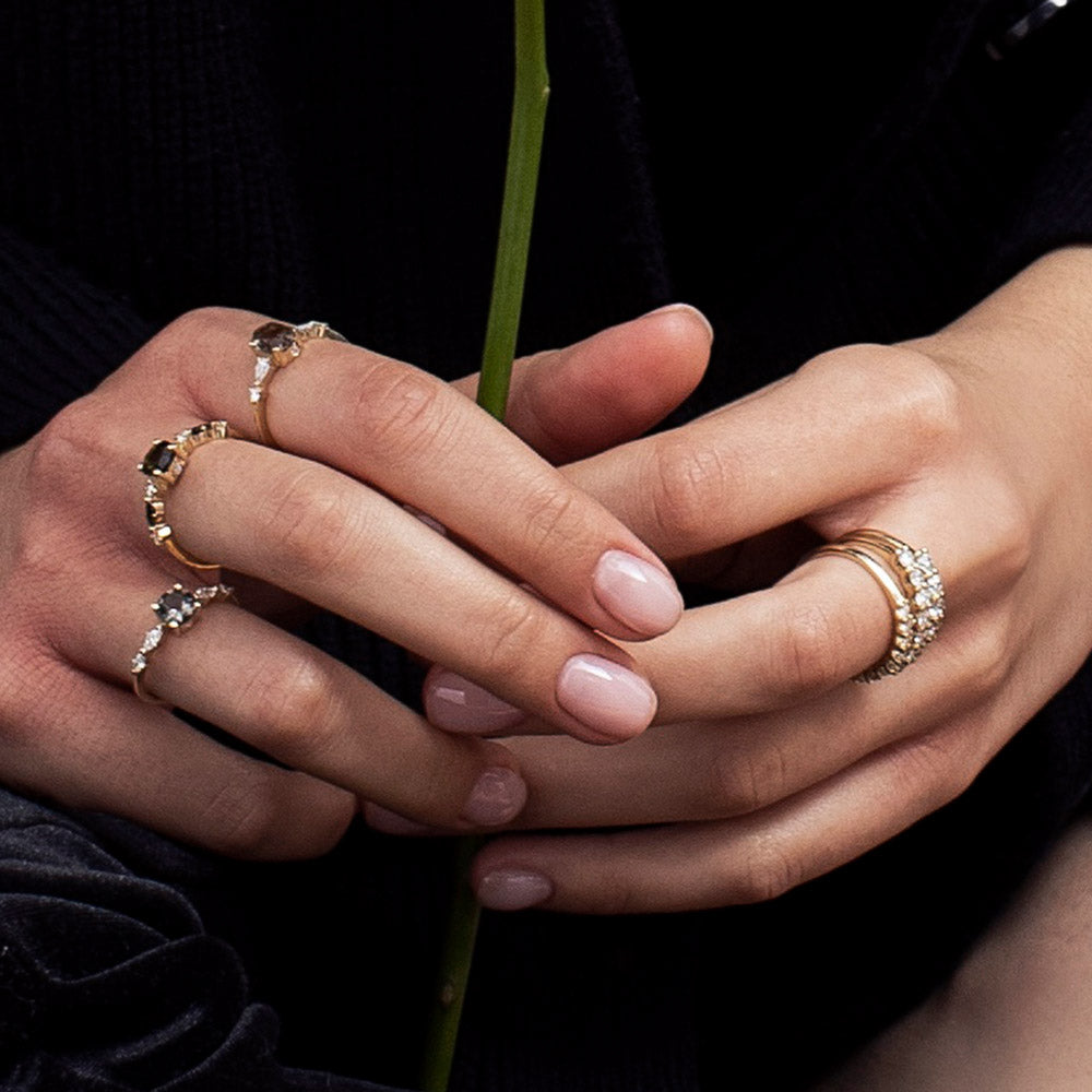 Gold ring with 9 diamonds weighing 5 points per diamond