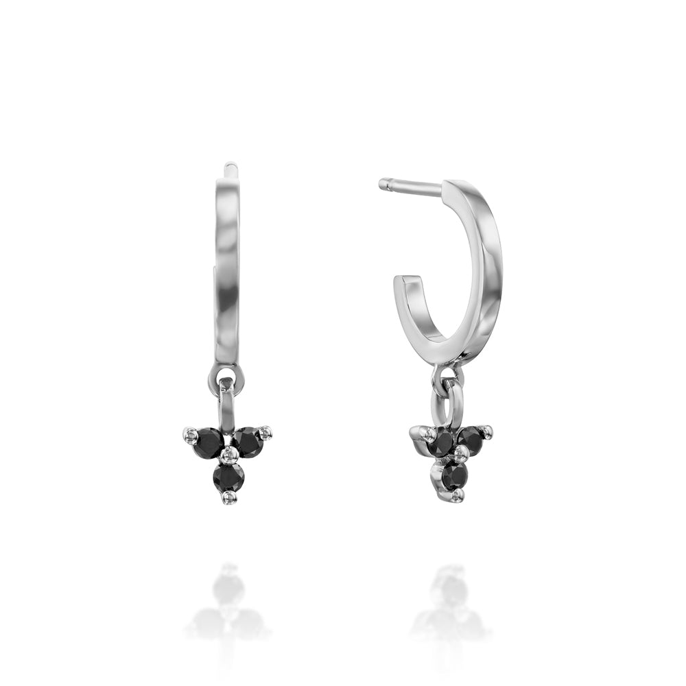Gold hoop earrings with a pendant studded with 3 black diamonds