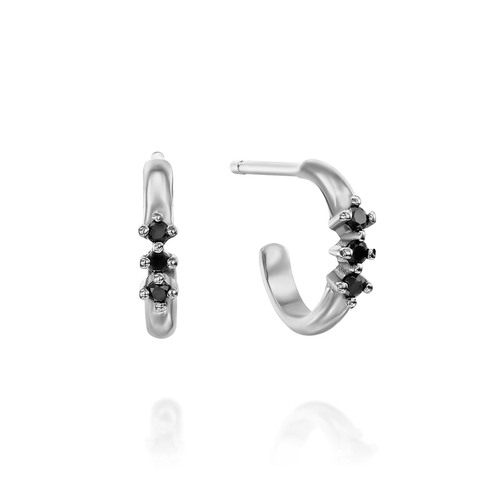 Small hoop earrings with a special setting of 3 black diamonds in each earring