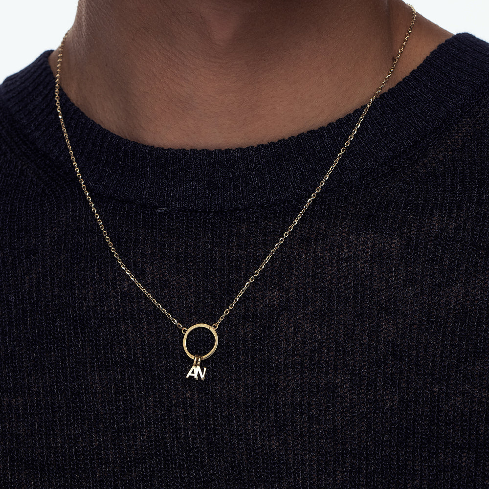 A special gold chain with letters. Name necklace for man and woman