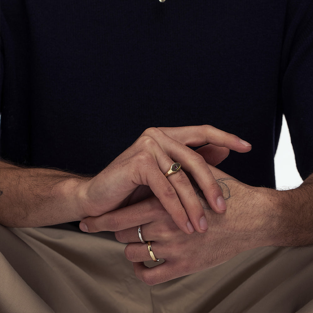 An octagon-shaped signet ring for men, set with princess-cut rubies