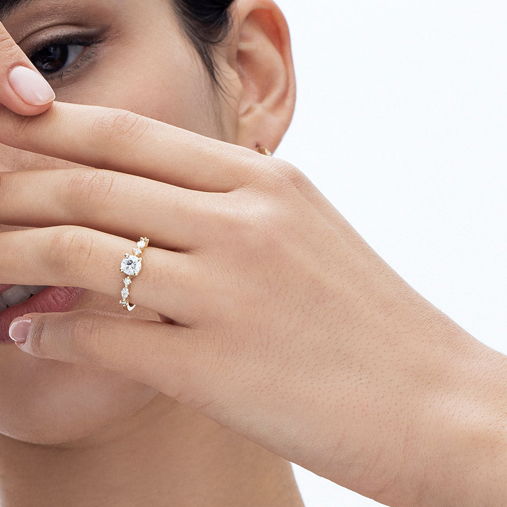 An impressive lab diamond ring set with a central round lab diamond combined with marquise-cut lab diamonds and round diamonds