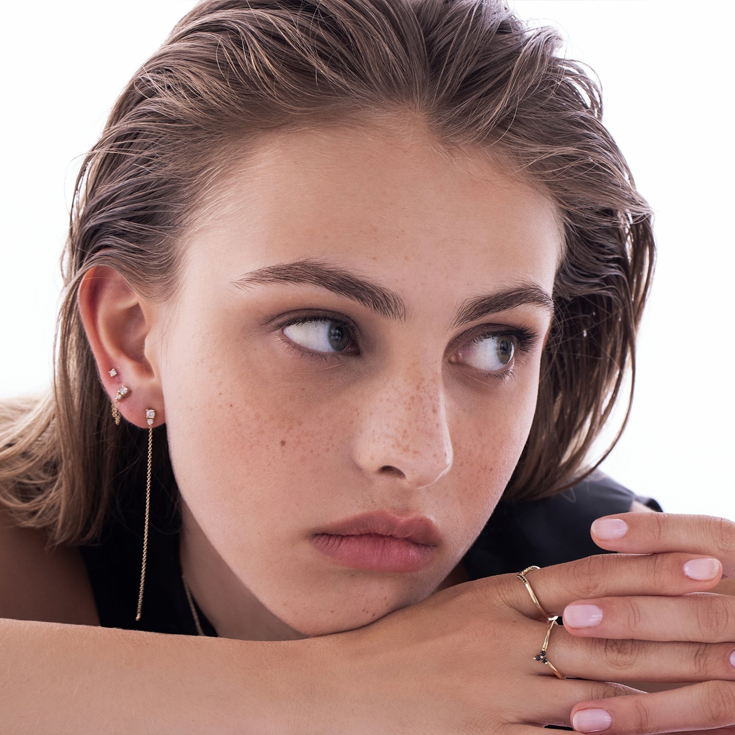 A special gold chain earring studded with laboratory diamonds