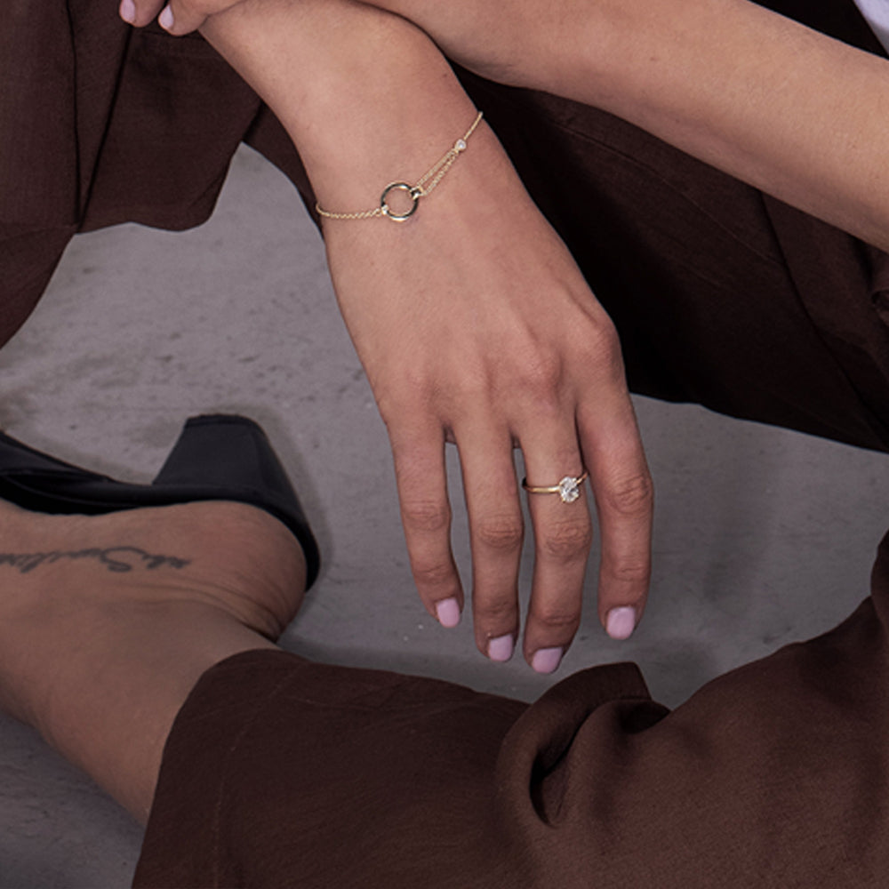 A special asymmetric gold bracelet in a modern and impressive design set with a diamond