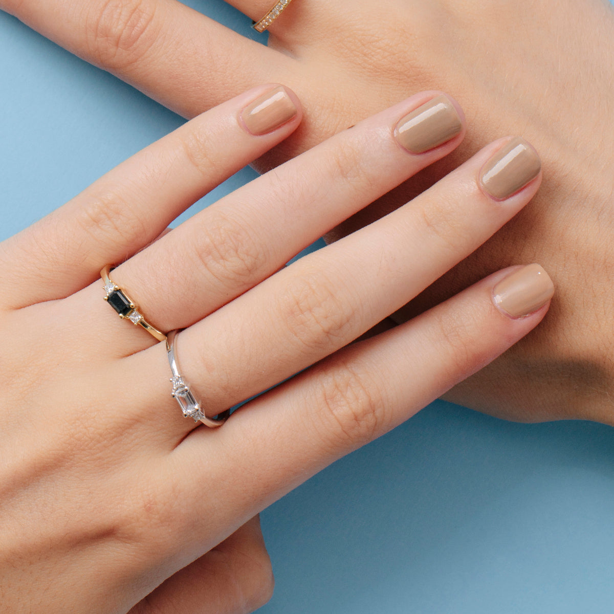 Emerald cut and princess cut diamond ring