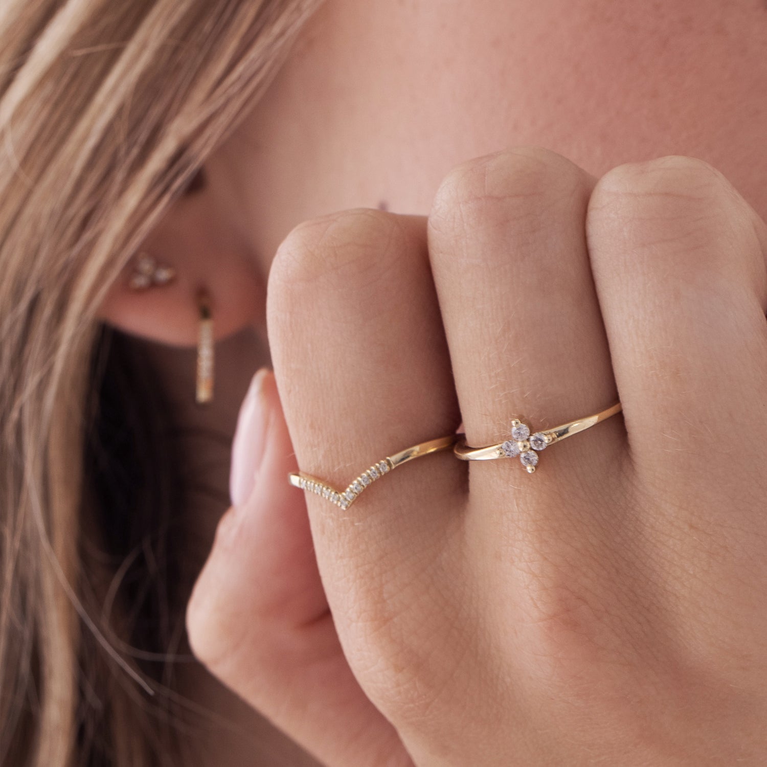 A delicate V gold ring studded with diamonds