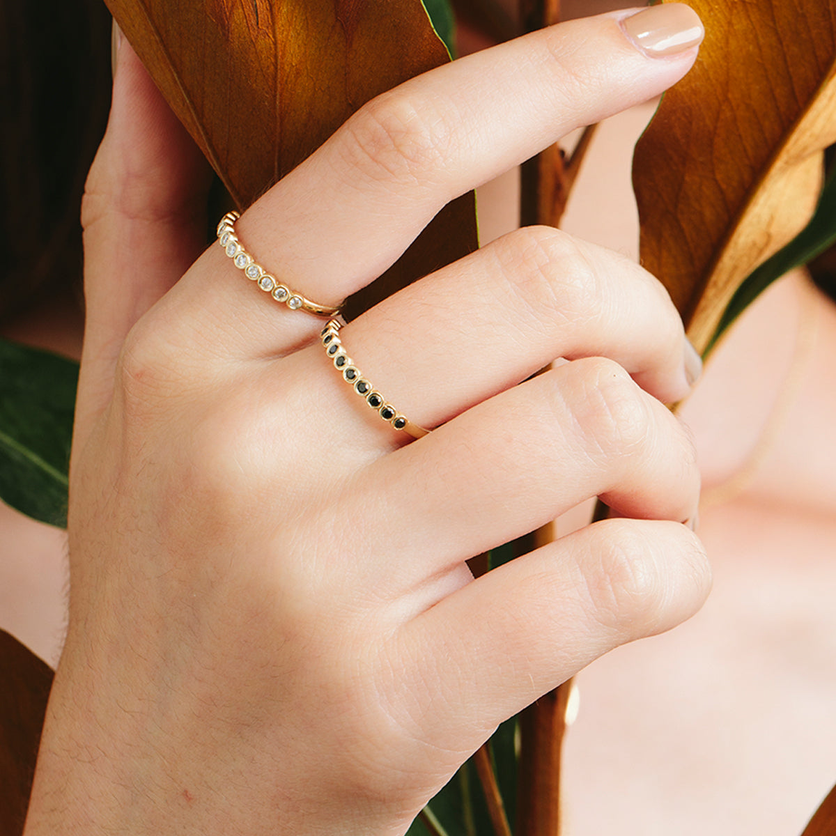 Gold ring with diamonds in cup setting
