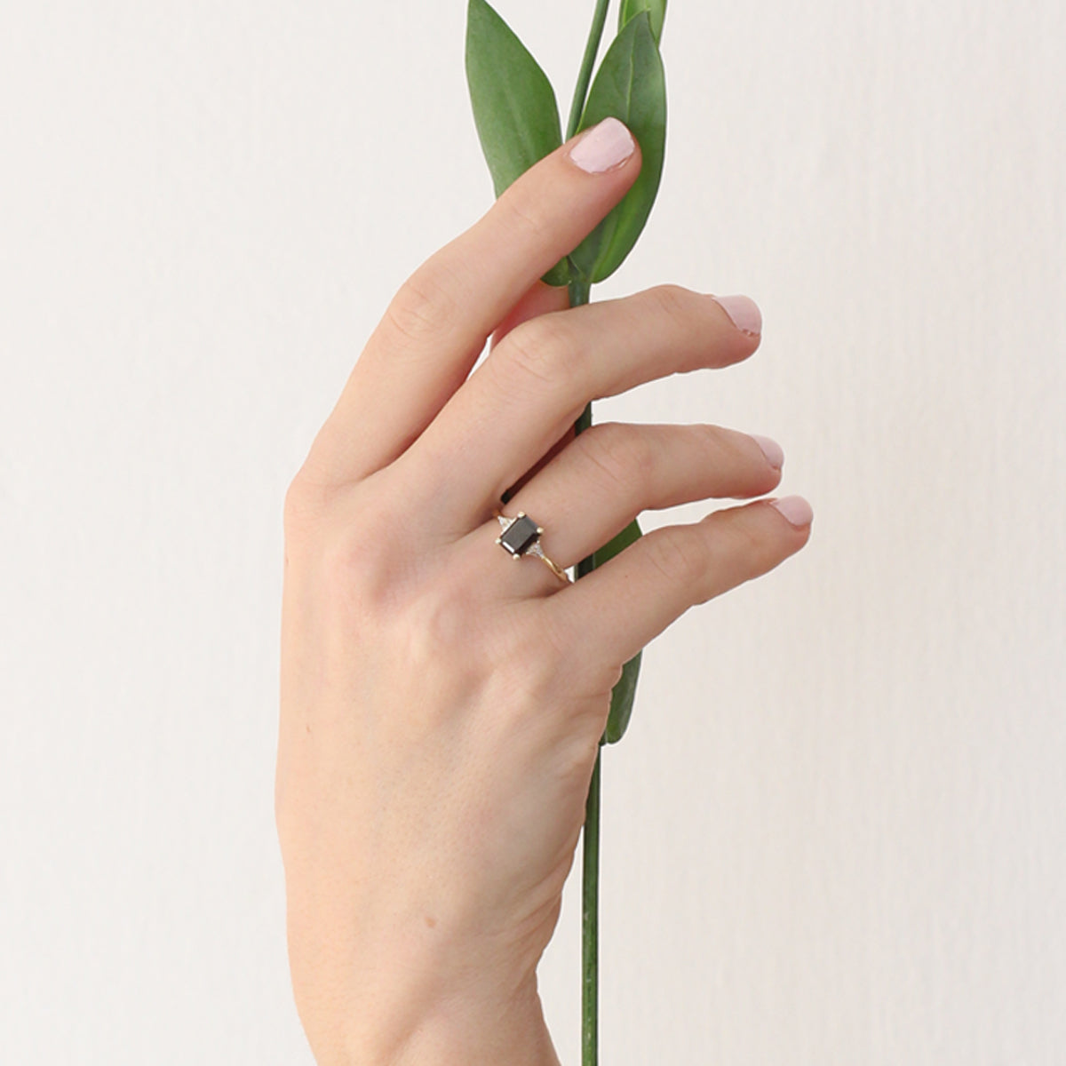 Rectangular black diamond ring and white triangular diamonds
