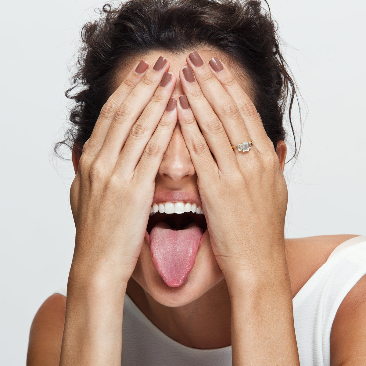 A gold ring inlaid with 3 moonstone stones in a rectangular cut