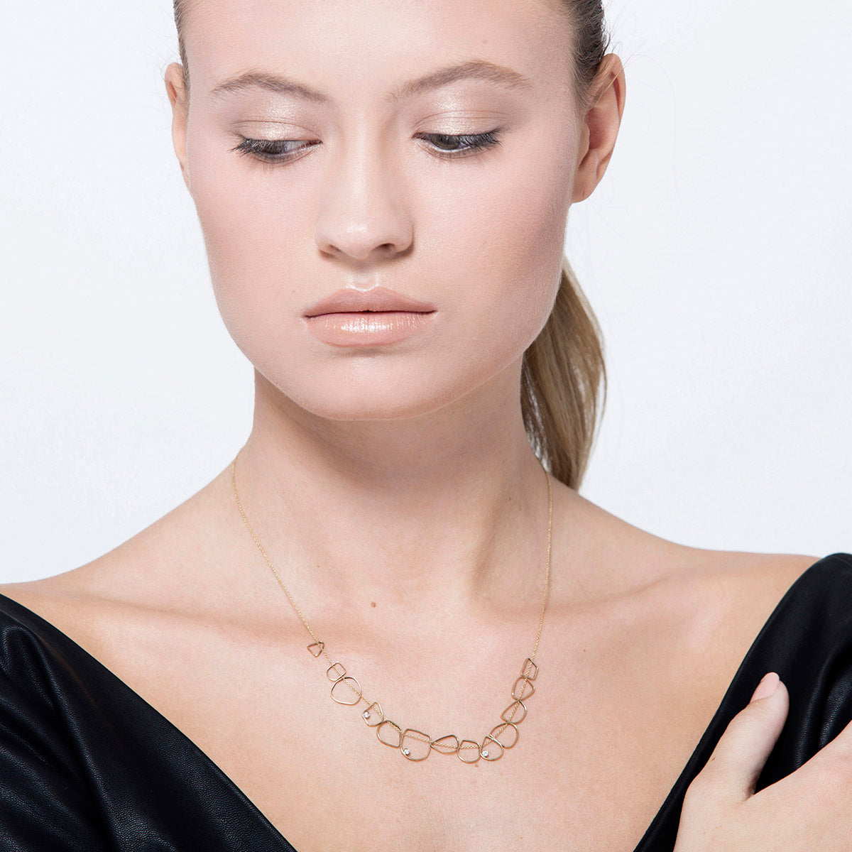 A designed gold chain consists of 13 links and 3 diamonds