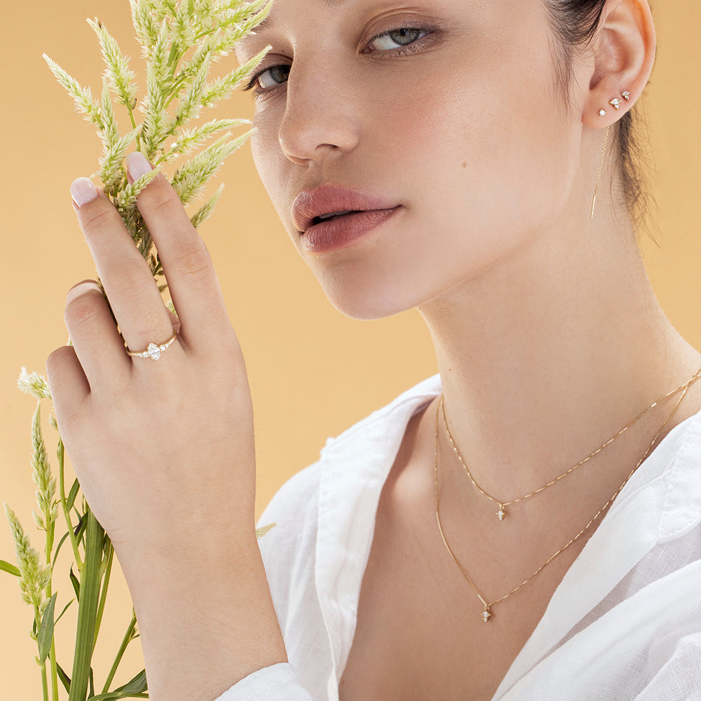Fine gold chain with a diamond pendant combined with a marquise-cut diamond (7 points) and a round diamond