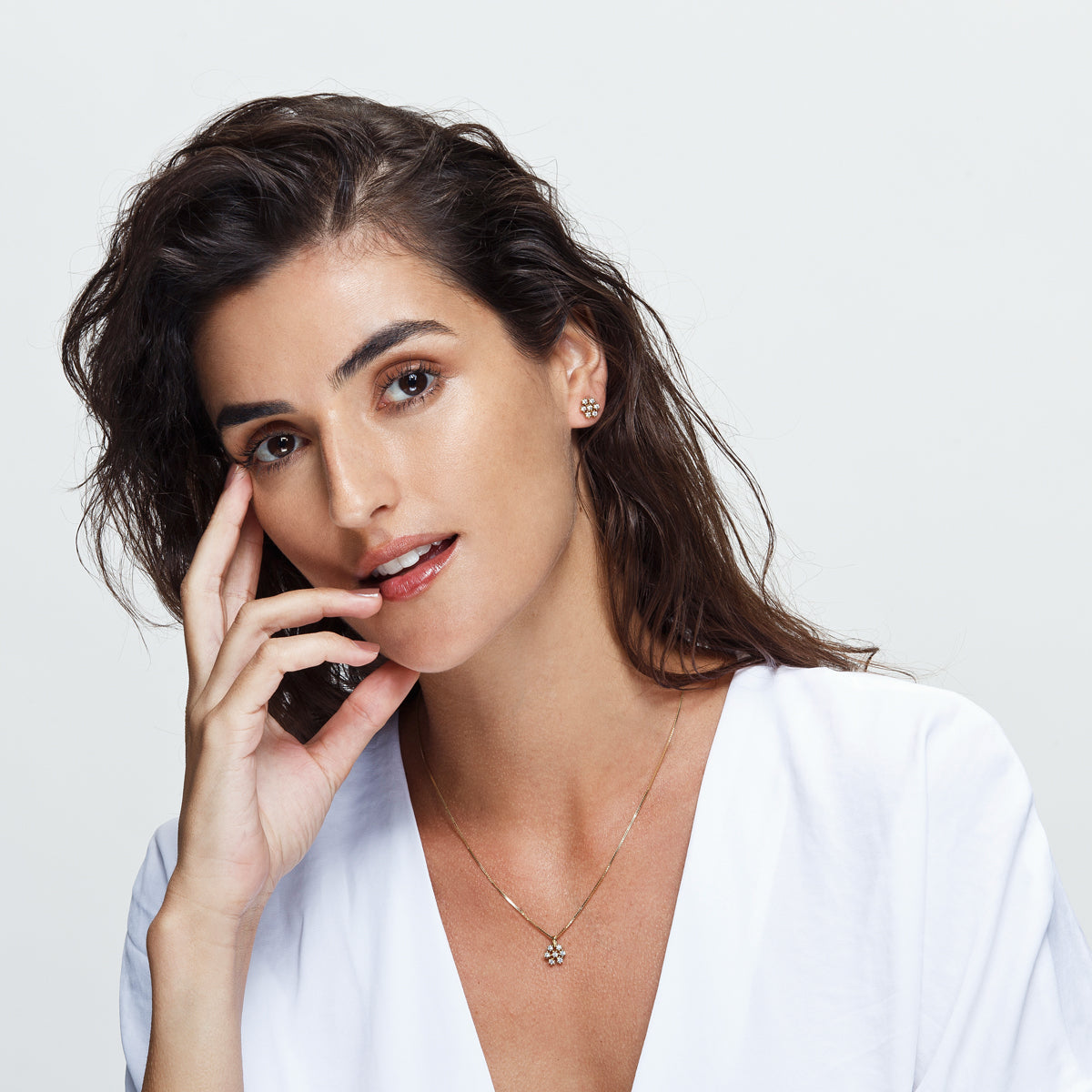 Gold chain and snowflake pendant studded with diamonds