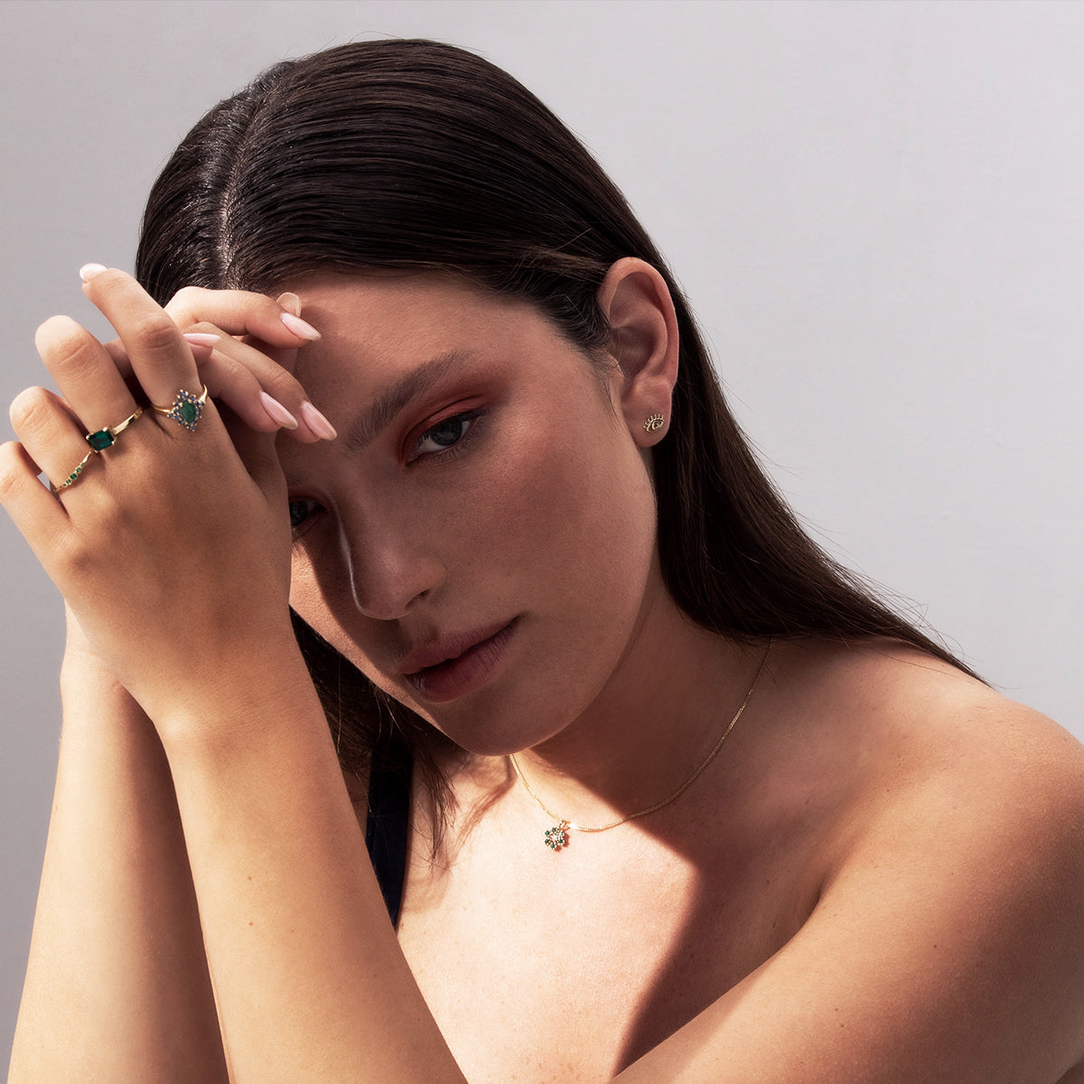 Stud earrings with a small gold eye design