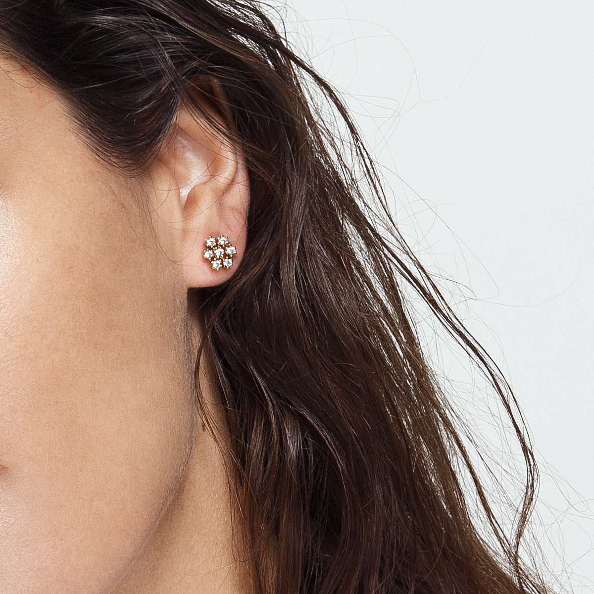 Studded diamond earrings inspired by a snowflake