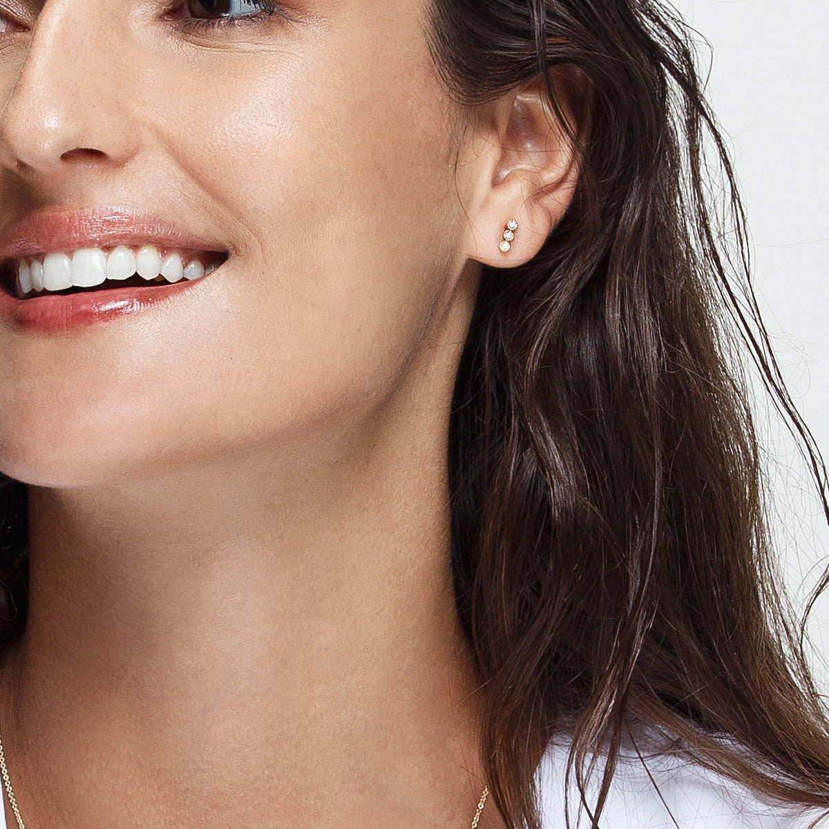 Black diamond earrings attached to gold
