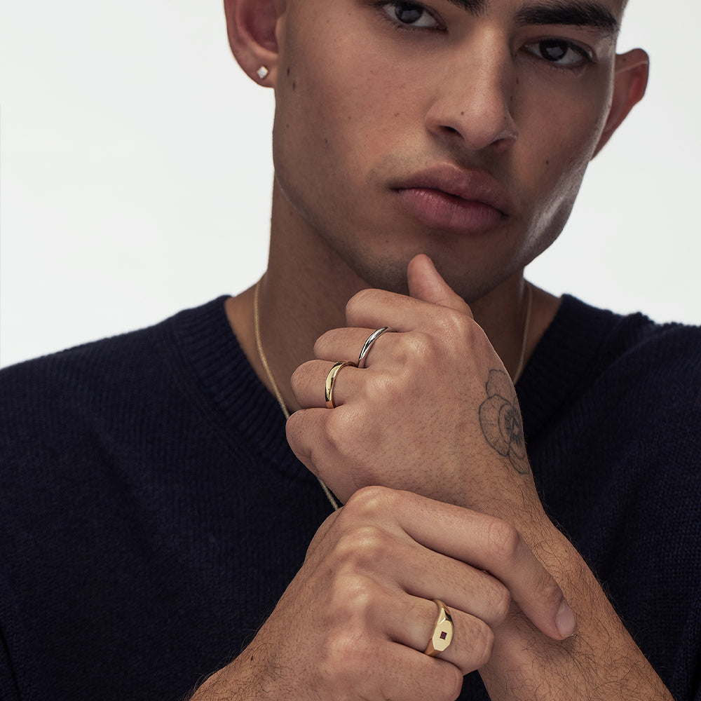 An octagon-shaped signet ring for men, set with princess-cut rubies