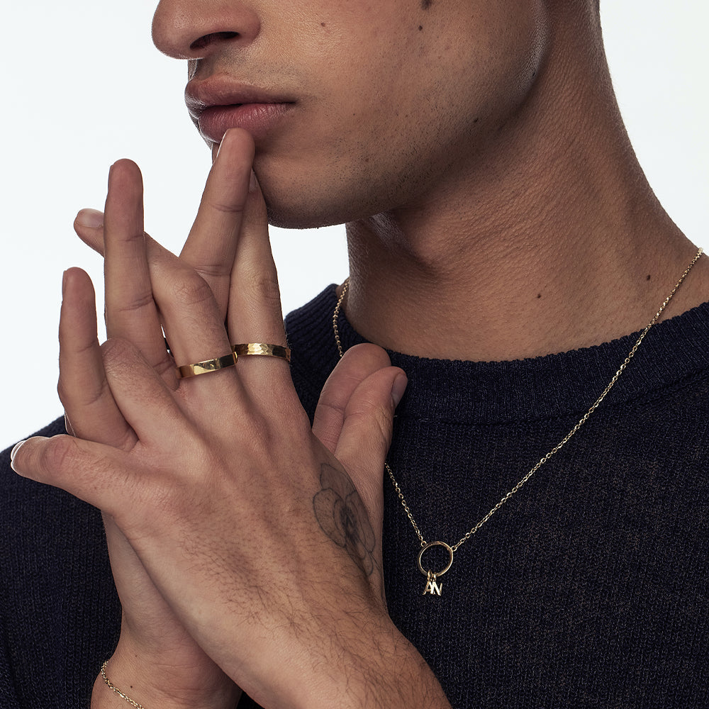 A special gold chain with letters. Name necklace for man and woman