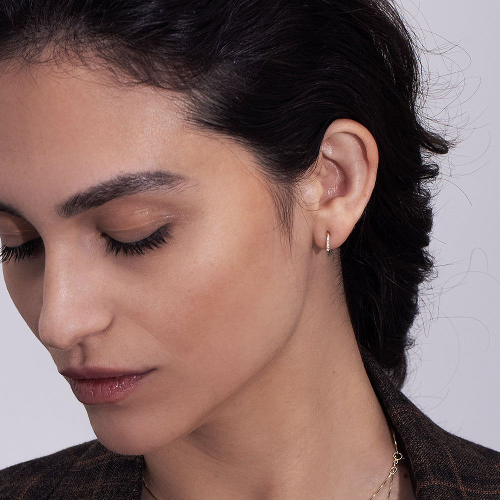 Small gold hoop earrings set with 10 pavé diamonds
