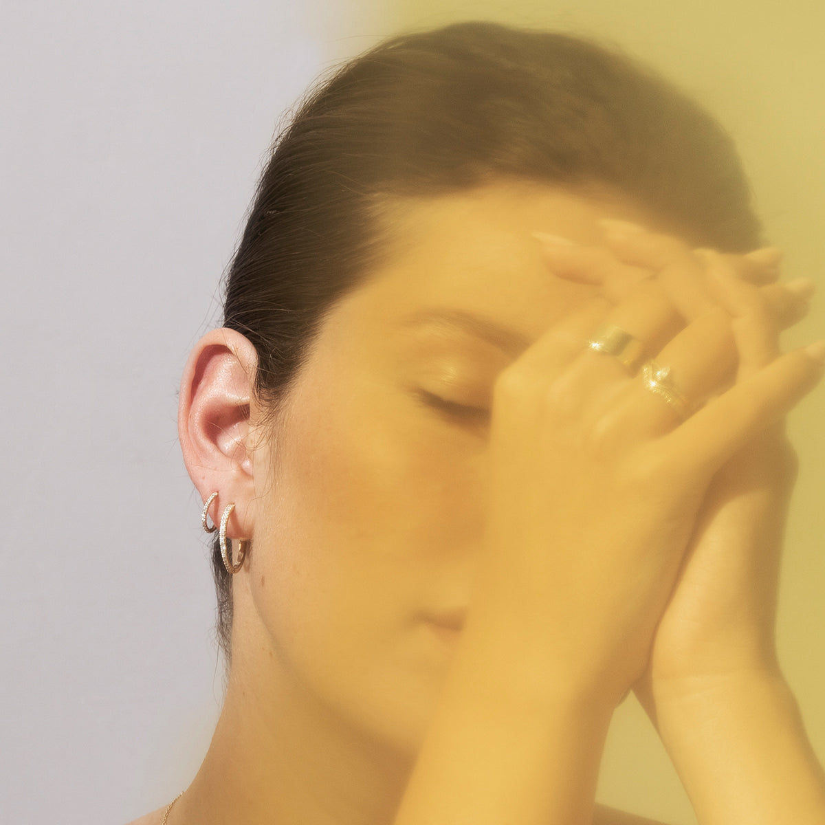 A gold ring with a wave set with diamonds