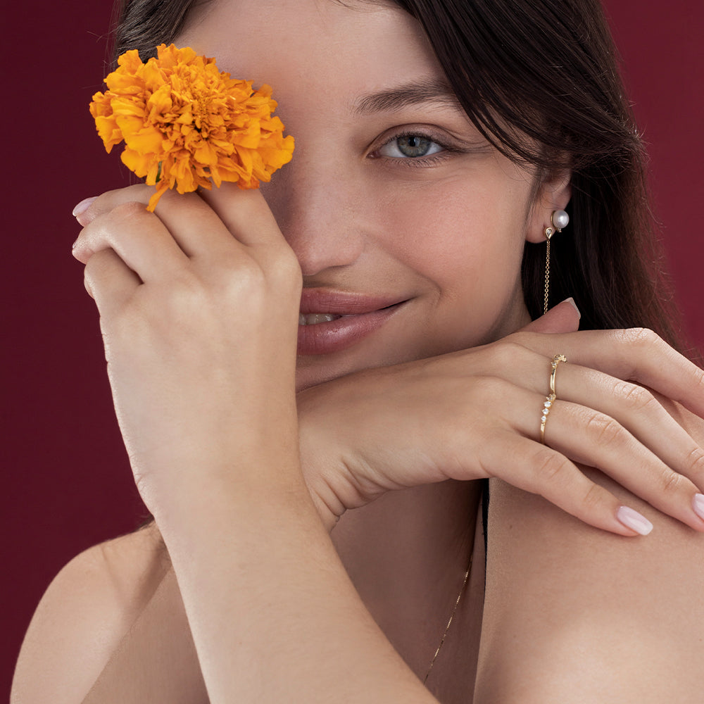A delicate diamond ring set with 5 diamonds in a special setting